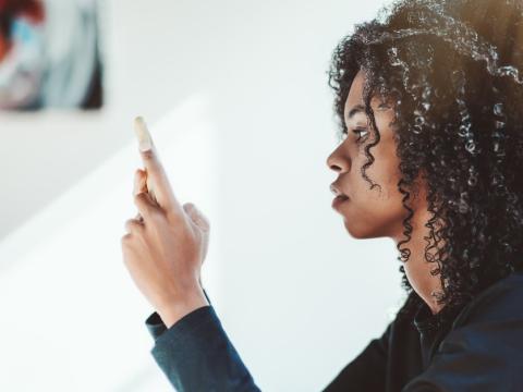 Young woman viewing smartphone