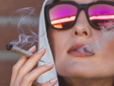 Woman smoking marijuana joint