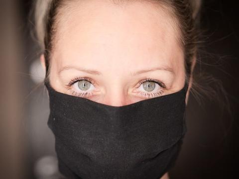 Woman wearing black mask