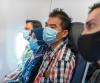 Airline passengers wearing masks