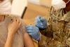 Army personnel giving COVID vaccination