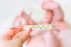 Baby with thermometer