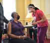 Woman getting prepped for COVID vaccine