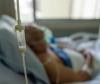 Older hospital patient on oxygen blurred