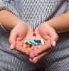 Capsules in hands