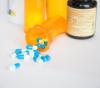 Capsules spilling from bottle