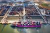 Cargo containers being loaded onto ship