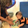 Childcare worker with baby