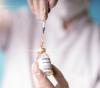 COVID vaccine vial and syringe