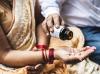Couple in India with bottle of pills