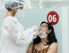 Woman getting COVID-19 swab test