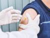 COVID vaccine going into man's arm