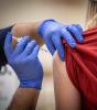 COVID vaccine in arm