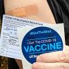COVID vaccine sticker and card