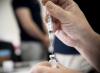COVID-19 vaccine being drawn into a syringe