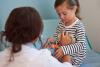 Doctor examining girl