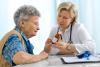 Doctor explaining dosage to elderly patient