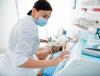 Doctor wearing surgical mask at bedside