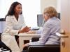Doctor consulting older patient