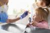 Doctor examining little girl
