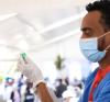 Drawing COVID vaccine into vial