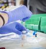 Drawing the Moderna COVID vaccine into a syringe