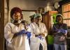 Healthcare workers donning gloves