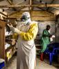 Ebola health worker donning gloves