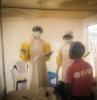 DR Congo Ebola health workers with patient