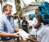 Ebola survivor receiving certificate