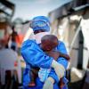 Ebola survivor holds baby
