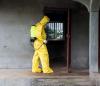Ebola worker disinfecting