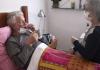 Elderly couple, man in bed