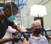 Elderly man getting COVID-19 vaccine