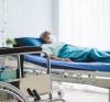 Elderly man in hospital bed