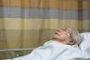 Elderly woman in hospital bed