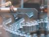 Empty glass bottles on production line