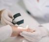 Examining hand of patient