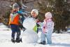 Family building snowman