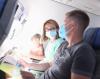 Couple wearing masks on plane