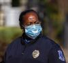 Female police officer wearing a mask