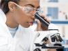 Female scientist at microscope