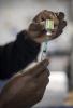 Flu vaccine filling syringe from vial