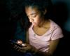 Girl on smartphone at night
