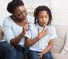 Girl with asthma mom with inhaler
