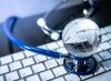 Globe and stethoscope on keyboard