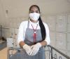 Grocery worker wearing mask