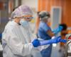 Healthcare worker putting on gloves