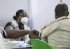 Healthcare worker giving COVID vaccine