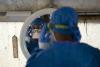 Health worker donning PPE